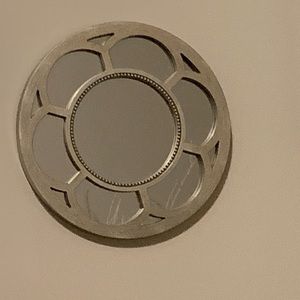 Three silver small circular mirrors. Perfect for a little girl’s room.